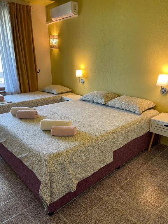 Postel nebo postele na pokoji v ubytování AMADINA Garden