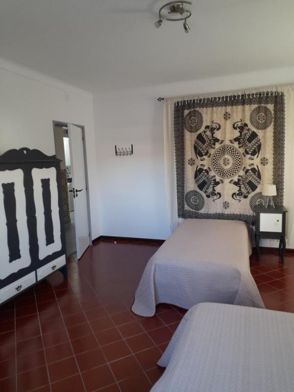 Ένα ή περισσότερα κρεβάτια σε δωμάτιο στο Casa das Andorinhas