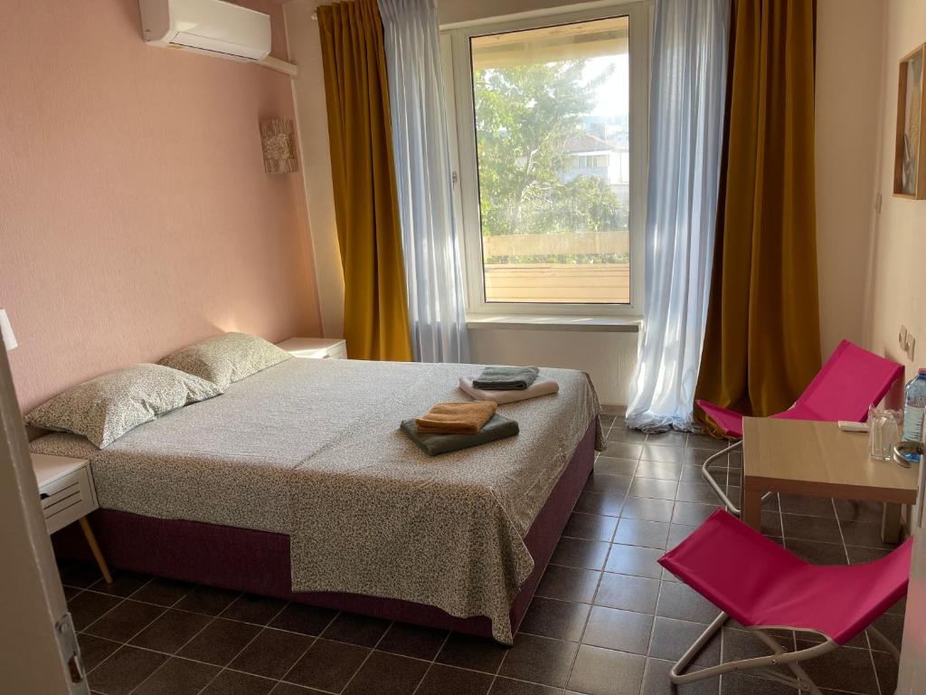 Postel nebo postele na pokoji v ubytování AMADINA Garden