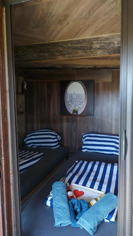 a bedroom with two bunk beds in a boat at Auszeit inmitten der Natur - its a kind of magic 