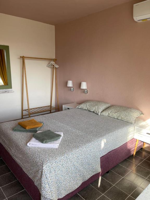 Postel nebo postele na pokoji v ubytování AMADINA Garden