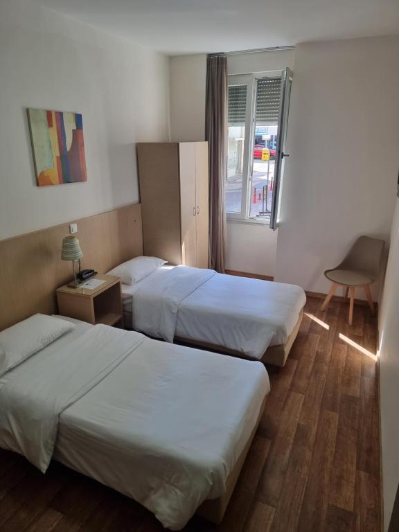 Postel nebo postele na pokoji v ubytování Kentrikon