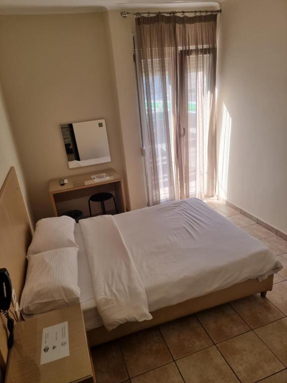 Postel nebo postele na pokoji v ubytování Kentrikon