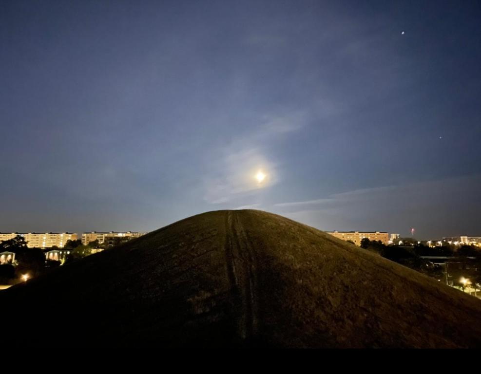 a hill with the moon on top of it at Hyllie apartment in Malmö