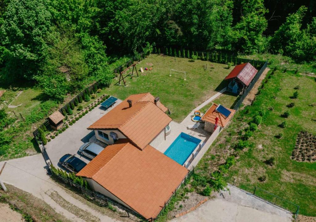 an aerial view of a house with a swimming pool at Villa Relax Tuzla in Tuzla