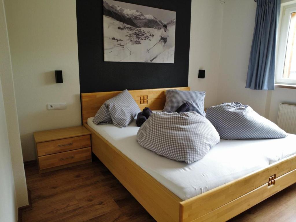 Postel nebo postele na pokoji v ubytování Aparthotels Berwang / Haus Wiesengrund