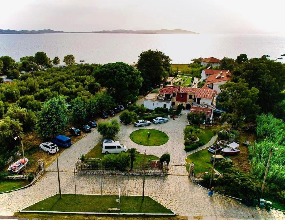 an aerial view of a parking lot next to the water at Hotel Paradise Ouranoupolis in Ouranoupoli