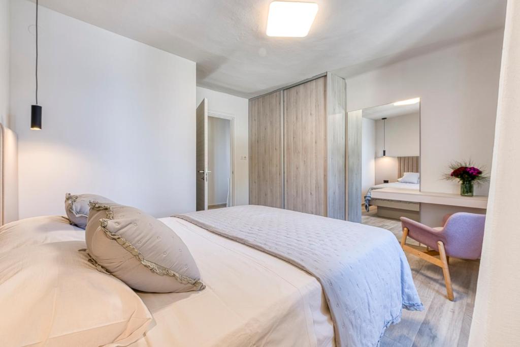 Posteľ alebo postele v izbe v ubytovaní Apartment Pasara