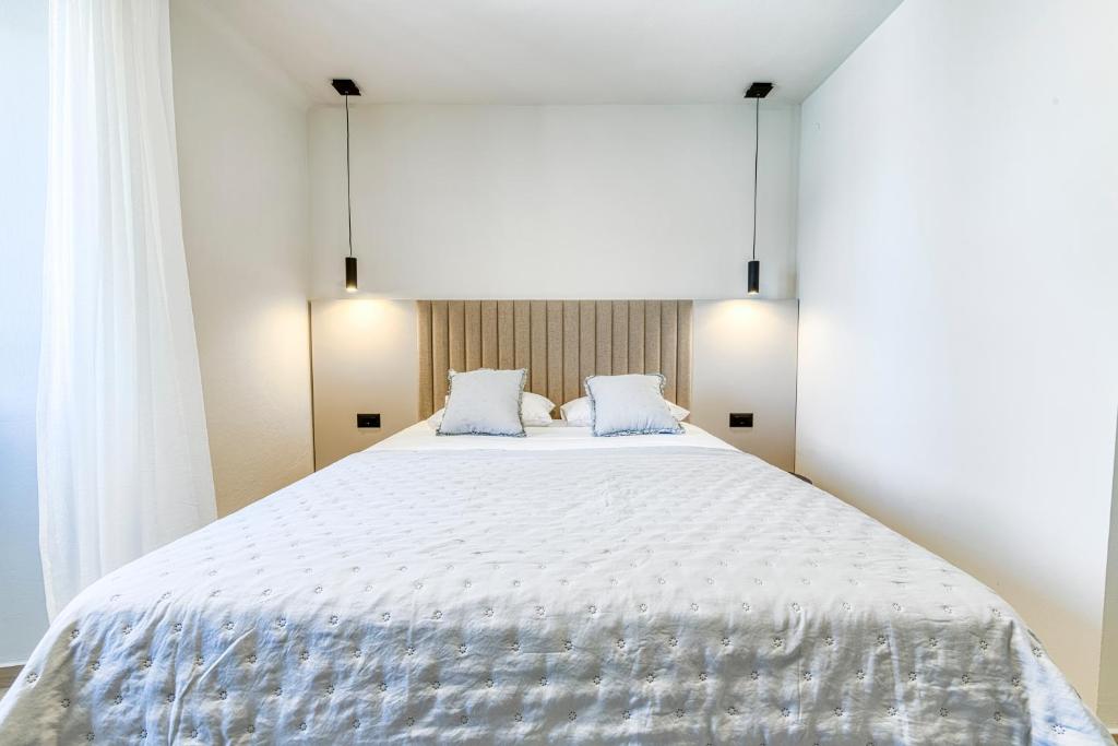 Posteľ alebo postele v izbe v ubytovaní Apartment Pasara