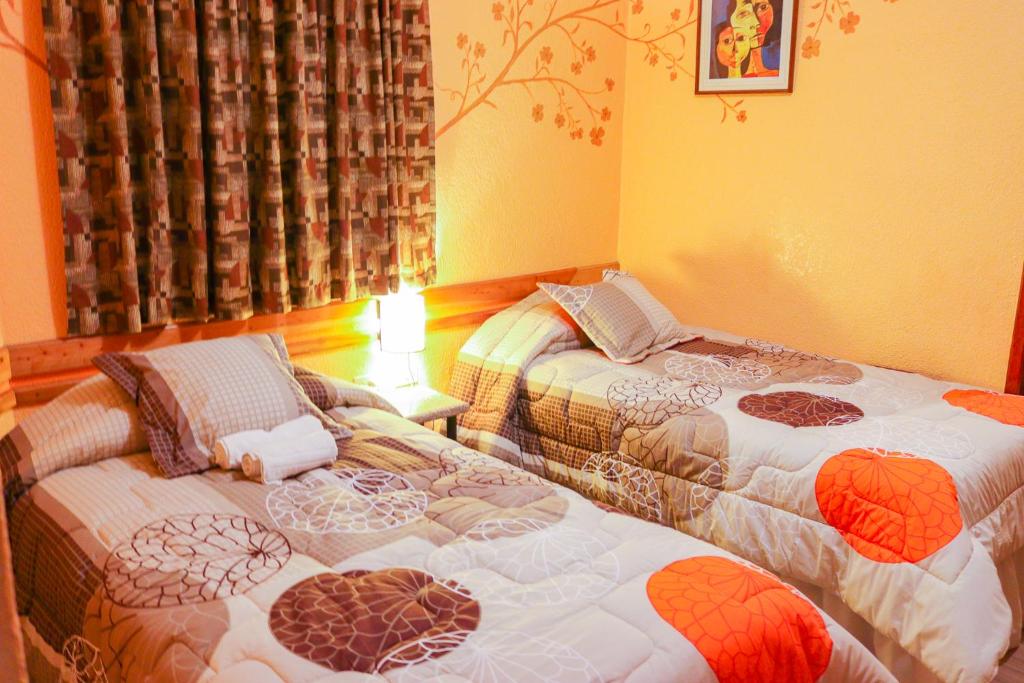 Postel nebo postele na pokoji v ubytování Hotel Rodelu