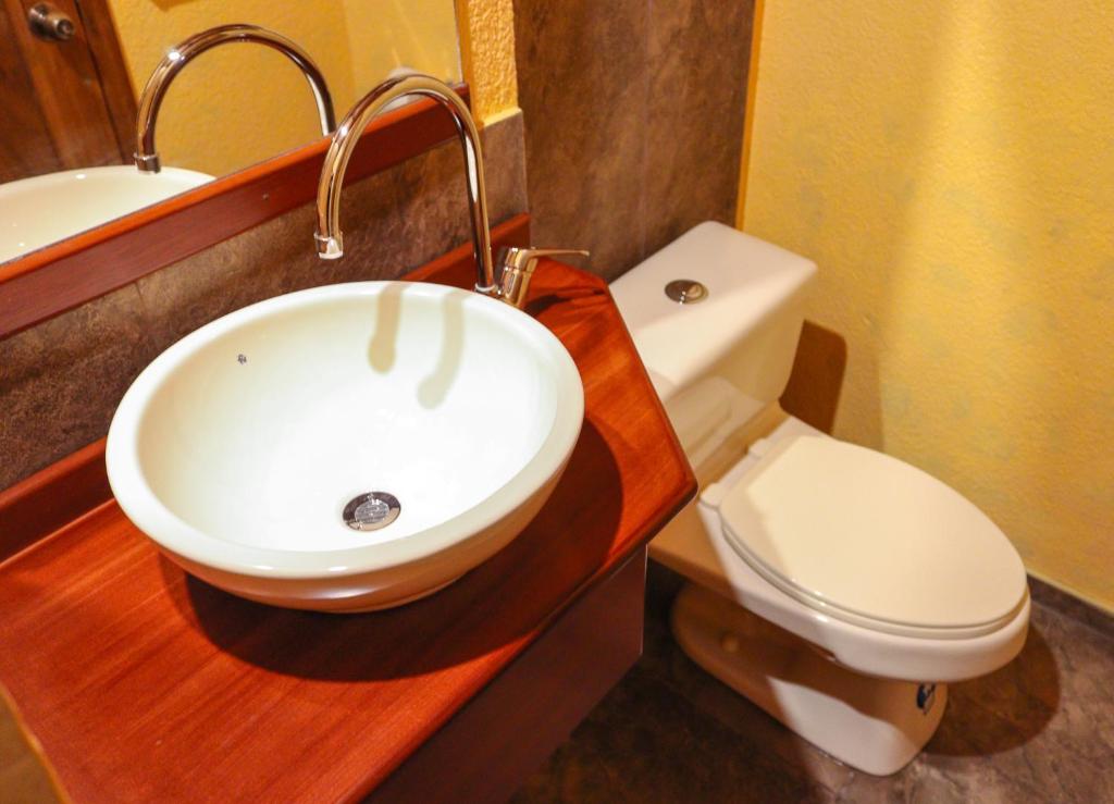 Koupelna v ubytování Hotel Rodelu