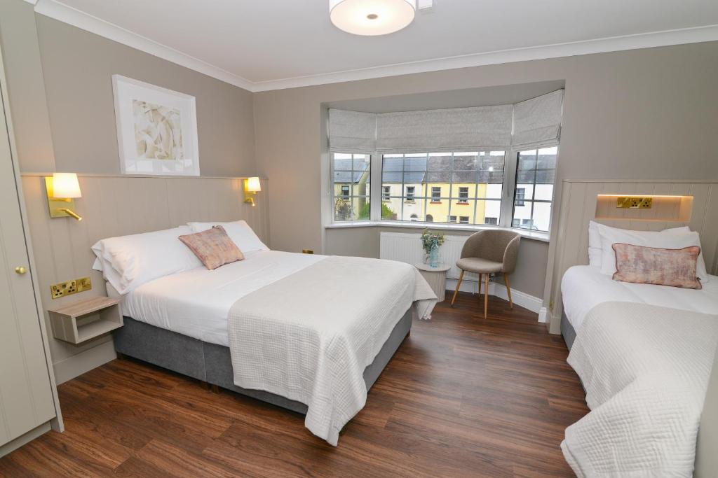 Postel nebo postele na pokoji v ubytování Urban Nest Townhouse