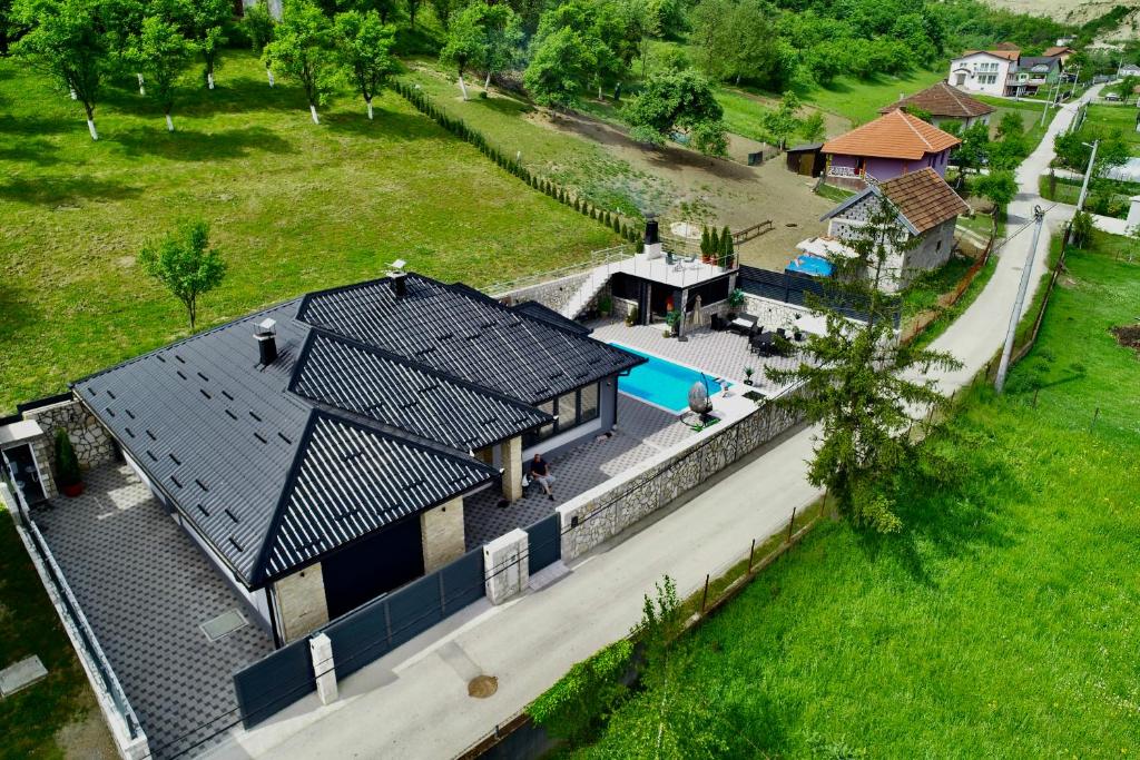 an aerial view of a house with a swimming pool at Villa Coco in Sarajevo