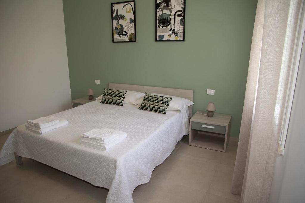 Postel nebo postele na pokoji v ubytování Casa Raineri