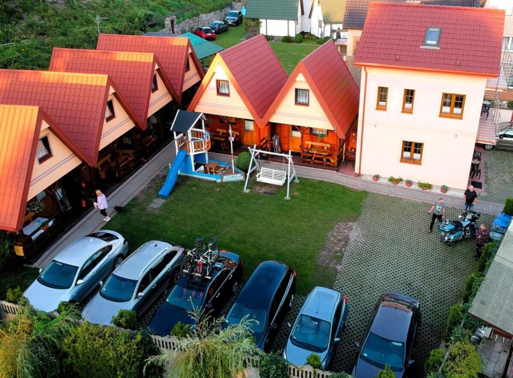 an aerial view of cars parked in a parking lot at Domki Letniskowe Neptun in Chłopy