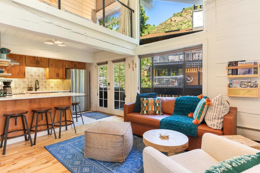 a living room with a couch and a table at Boho Chalet in Vail on Free Bus Route in Vail