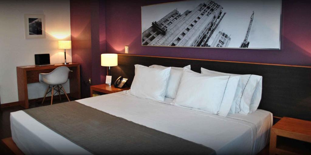 Postel nebo postele na pokoji v ubytování Hotel y Tú Expo