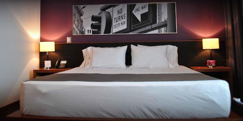 Postel nebo postele na pokoji v ubytování Hotel y Tú Expo