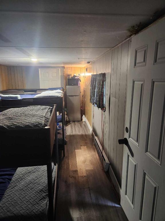 a room with two beds and an open door at Co-ed Dorm with Fantastic Patio! in Ewing