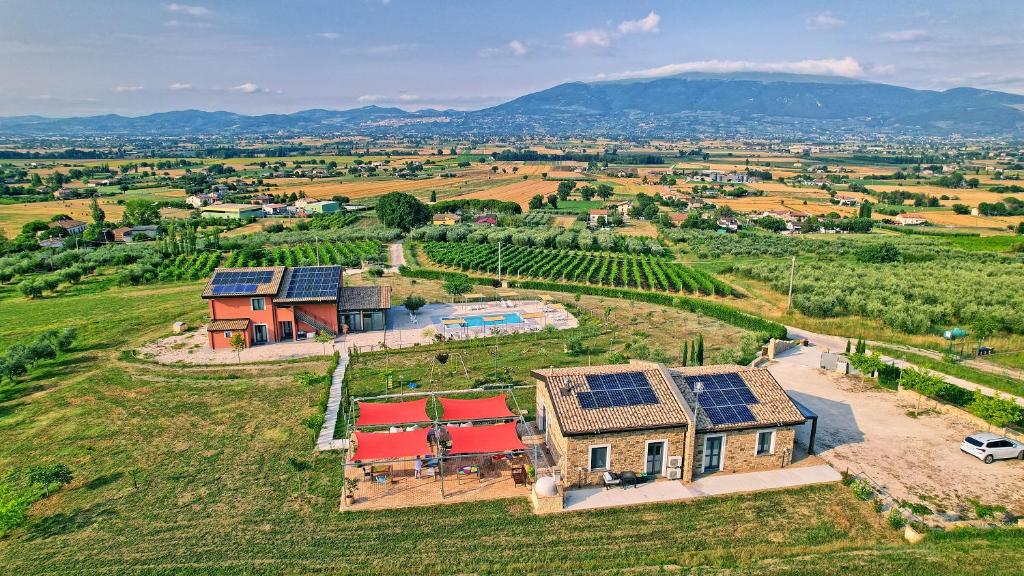 an aerial view of a house with solar panels on it at Agriturismo Incanto della Natura in Cannara