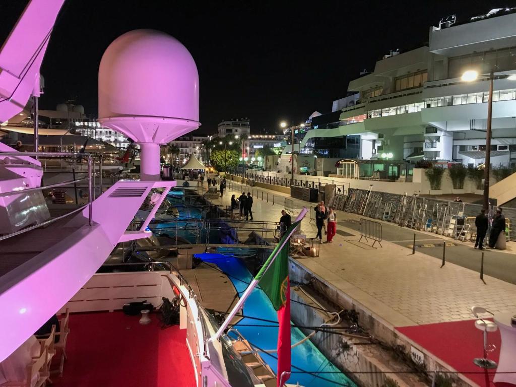 a boat is docked in a harbor at night at Cannes NG - Appartement à 10 mn du Palais des Festivals in Cannes