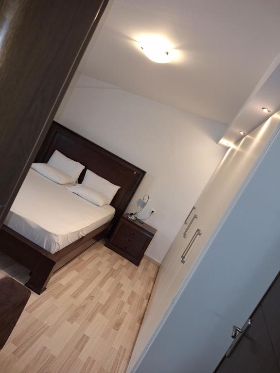an overhead view of a bedroom with a bed at revisapartments brown in Neos Marmaras