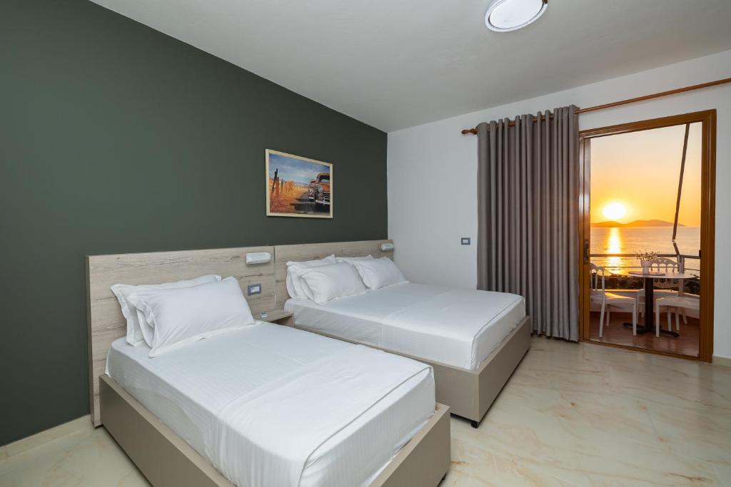 Postel nebo postele na pokoji v ubytování Hotel Idi