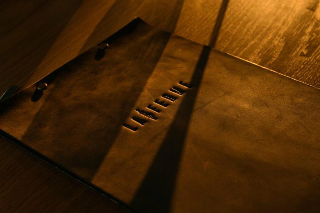a close up of a metal table on a wooden floor at La Ferme du Bien-etre in Saint-Julien-Chapteuil