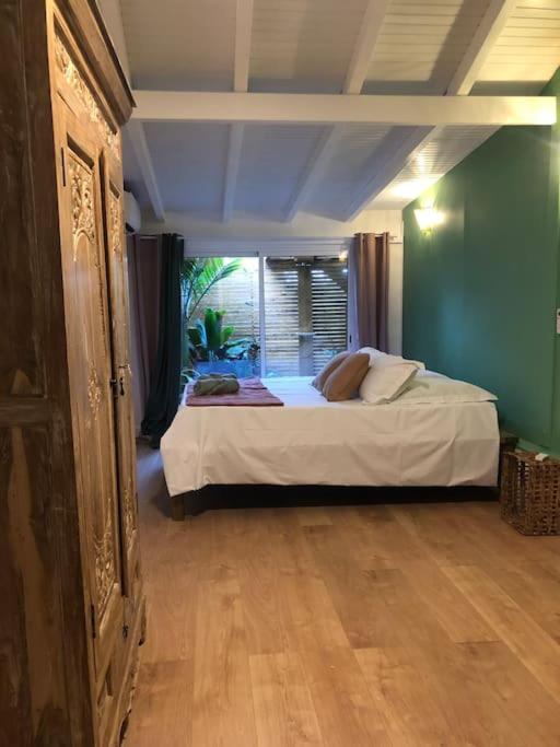 Postel nebo postele na pokoji v ubytování Villa bleu karaïbes