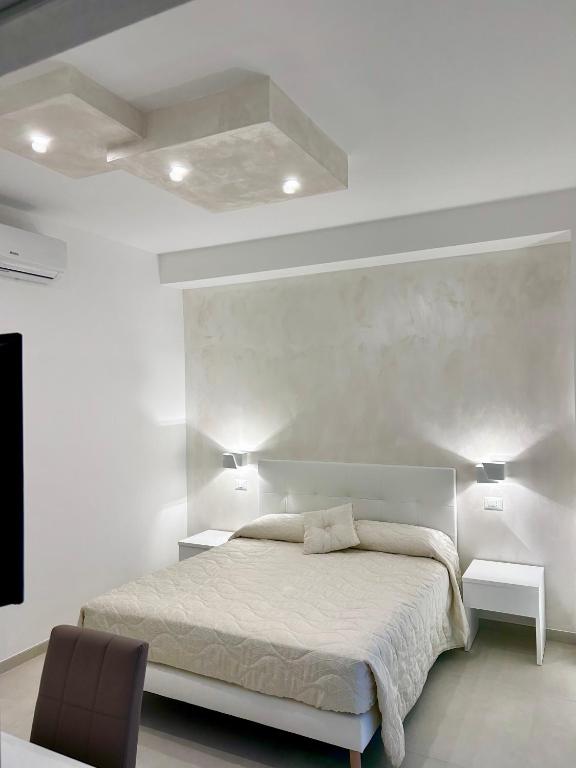 Postel nebo postele na pokoji v ubytování Gemini Luxury Rooms