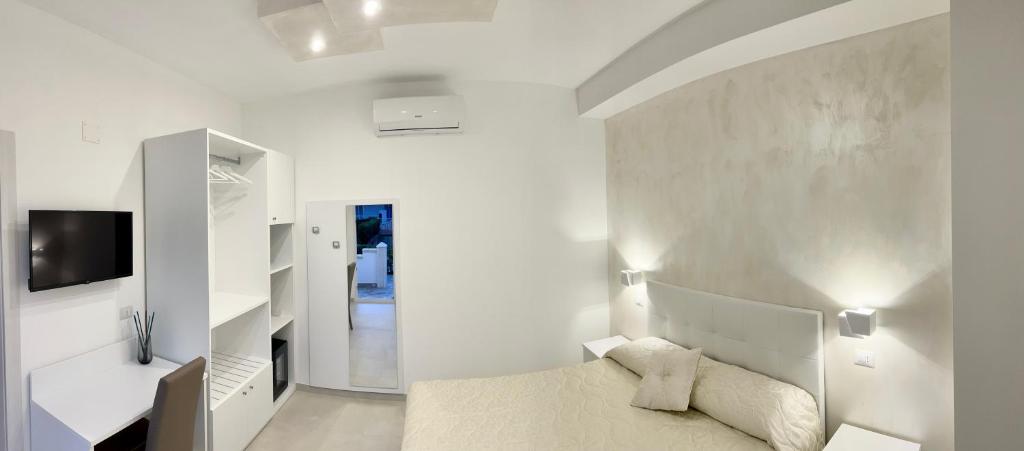 TV a/nebo společenská místnost v ubytování Gemini Luxury Rooms