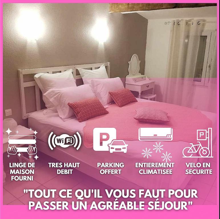 a poster of a pink bed in a room at La flemme en rose in Aigues-Mortes