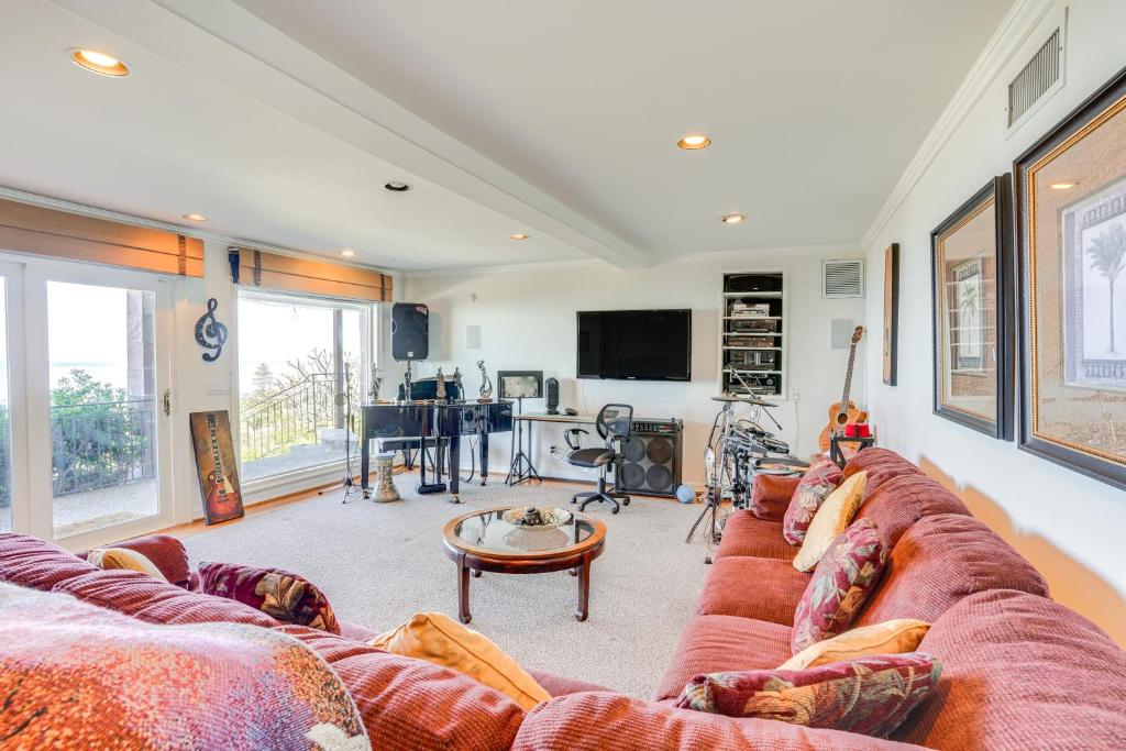 a living room with a couch and a table at Laguna Beach Getaway with Patio and Clear Ocean Views! in Laguna Beach