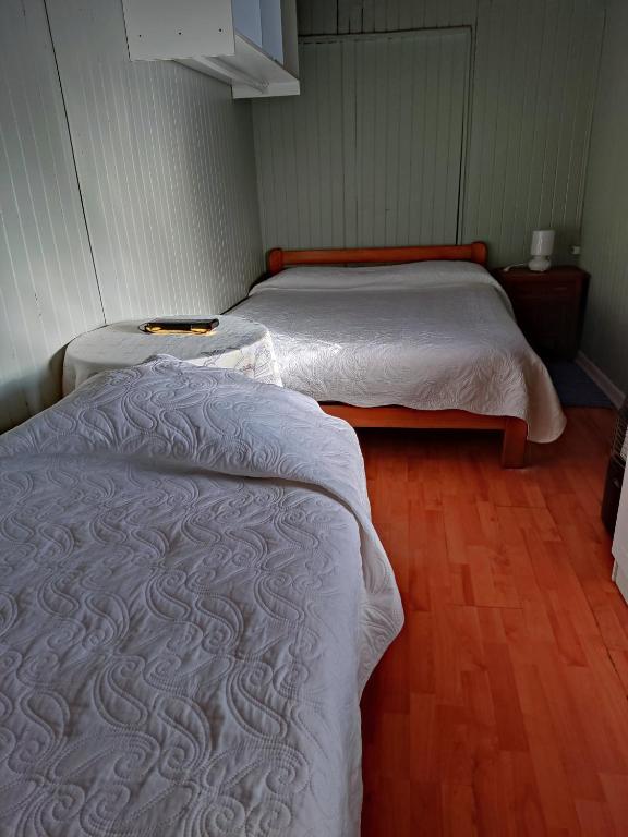 Postel nebo postele na pokoji v ubytování Hostal Saint Michell. El Quisco