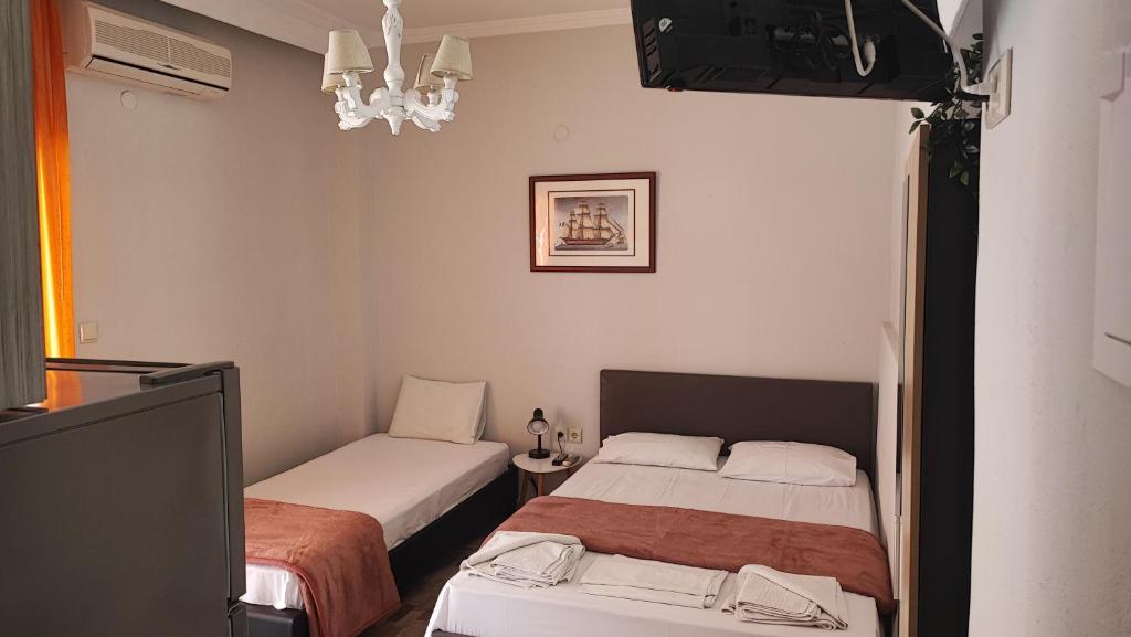 Postel nebo postele na pokoji v ubytování KALLIÁNI HOUSE vila kiki
