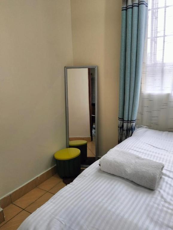 Postel nebo postele na pokoji v ubytování Tamara studio bedsitter, Nyanchwa Kisii
