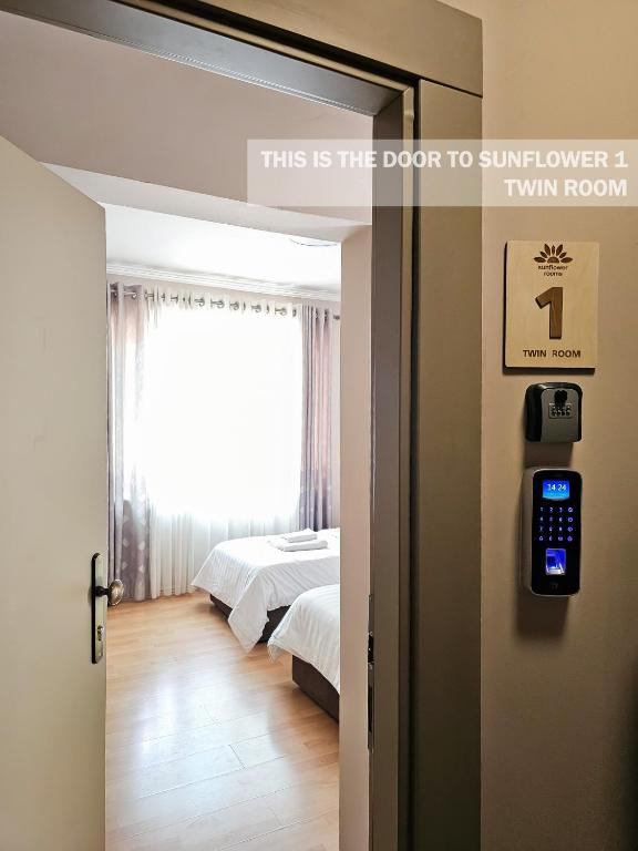 Postel nebo postele na pokoji v ubytování Sunflower Rooms