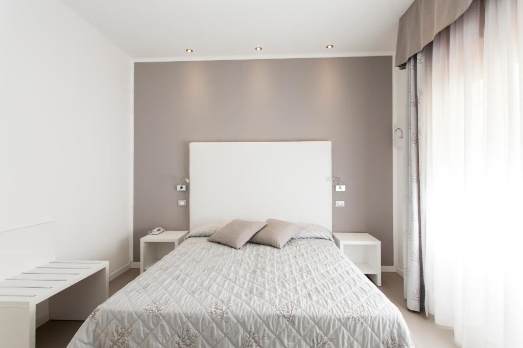 Postel nebo postele na pokoji v ubytování Hotel Grottamare
