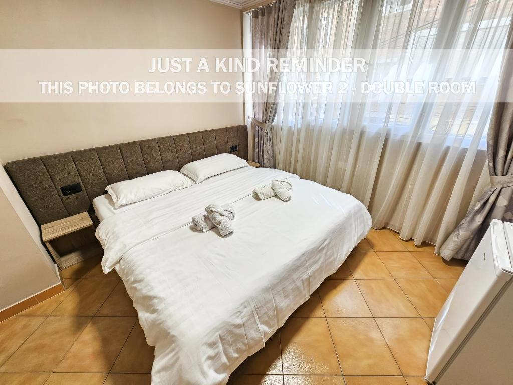 Postel nebo postele na pokoji v ubytování Sunflower Rooms