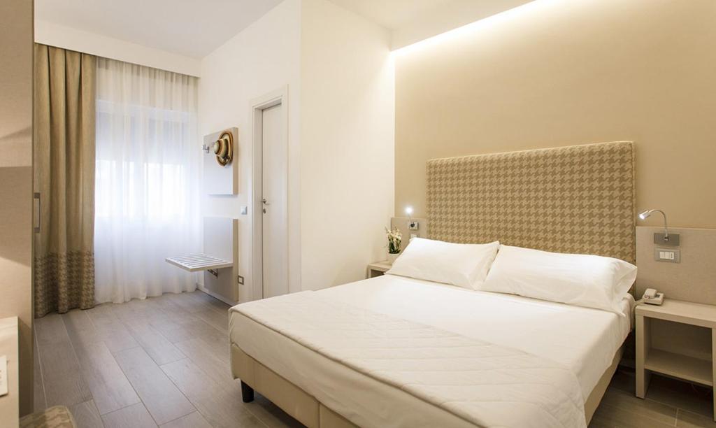 Postel nebo postele na pokoji v ubytování Hotel Grottamare