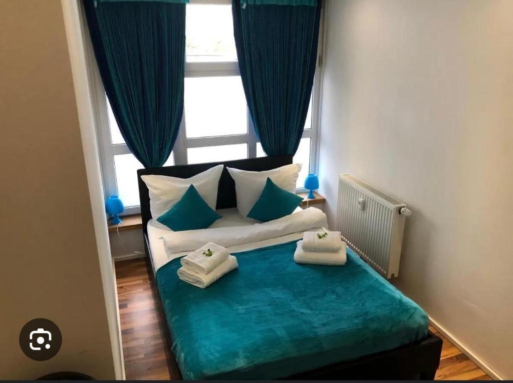 A bed or beds in a room at Pension Baku