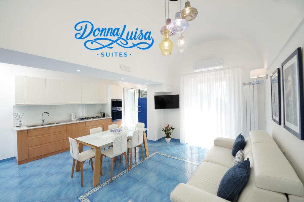 a living room with a couch and a table at Donna Luisa Suites 19 Amalfi view - free parking in Pontone