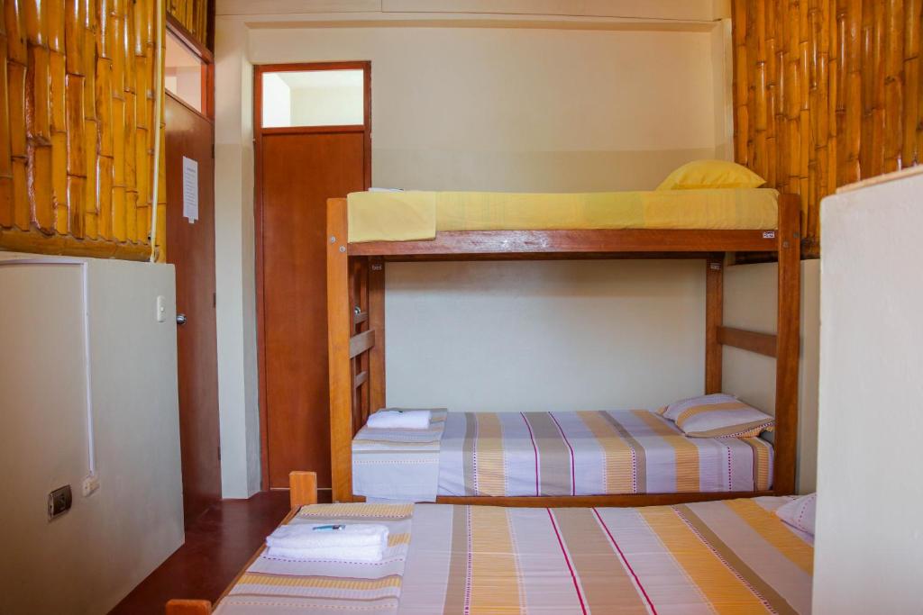 Postel nebo postele na pokoji v ubytování Hospedaje Guadalupe Inn
