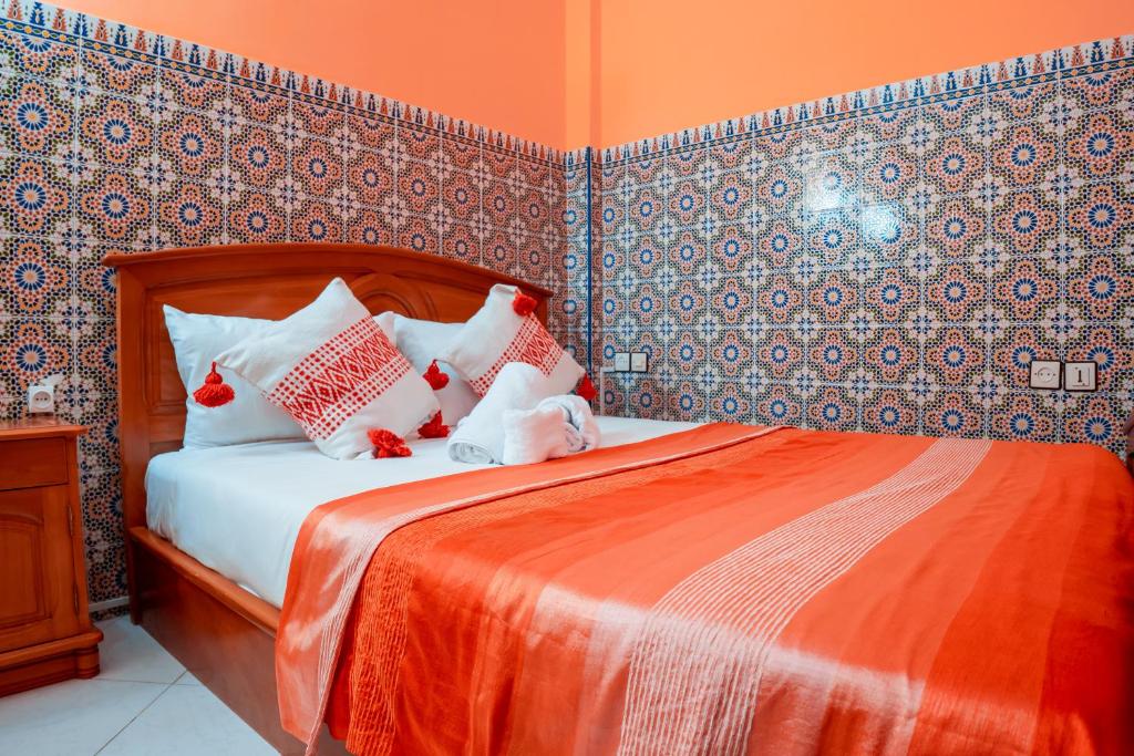 Postel nebo postele na pokoji v ubytování DAR CHEFCHAOUEN