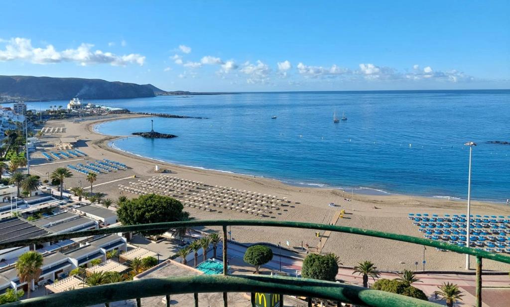 a view of a beach and the ocean at Frontal Ocean View Torres del Sol in Los Cristianos