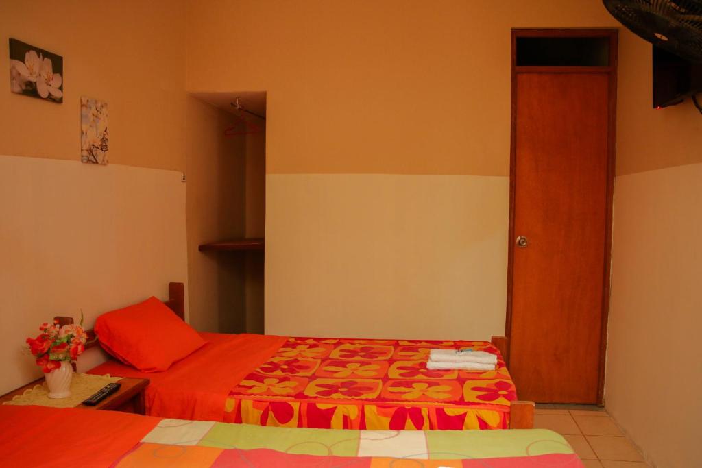 Postel nebo postele na pokoji v ubytování Hospedaje Guadalupe Inn