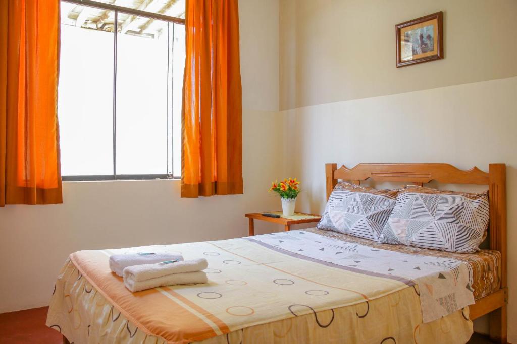 Postel nebo postele na pokoji v ubytování Hospedaje Guadalupe Inn