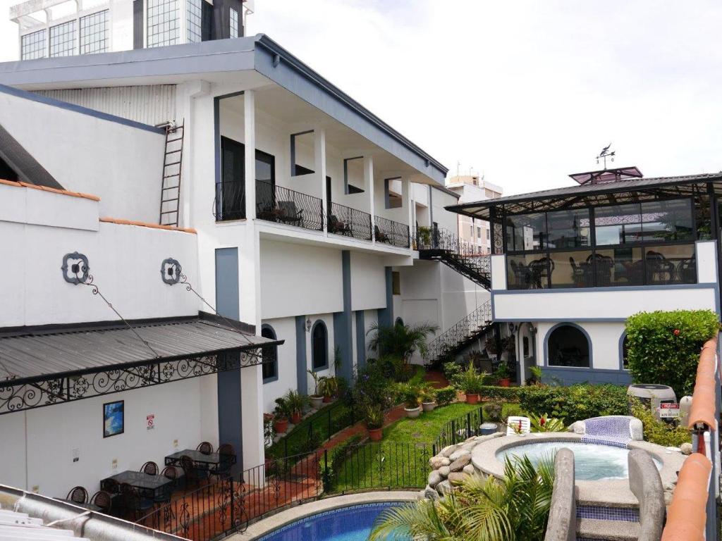 a person taking a picture of a building at Hotel Santo Tomas / Historical Property in San José