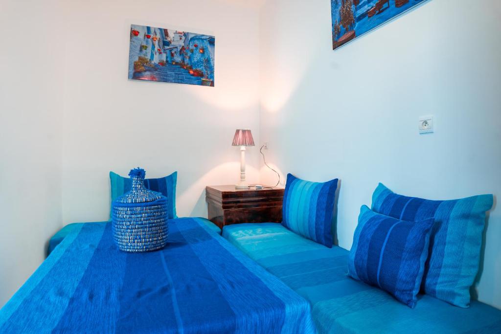 Postel nebo postele na pokoji v ubytování DAR CHEFCHAOUEN