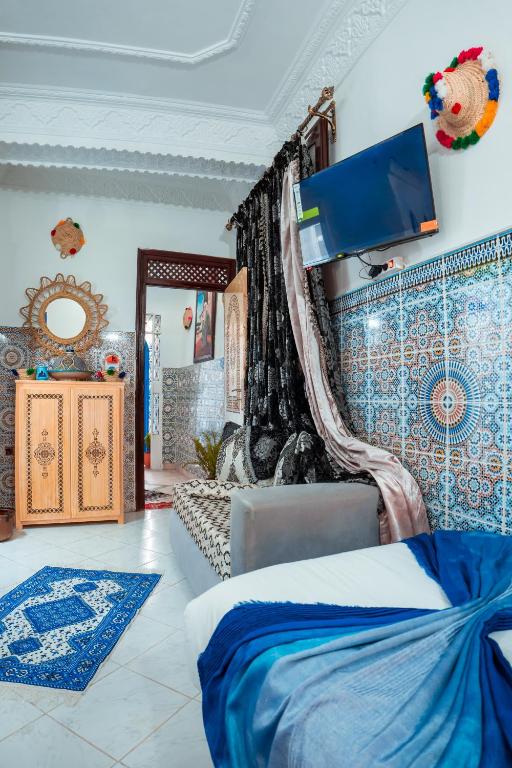Postel nebo postele na pokoji v ubytování DAR CHEFCHAOUEN